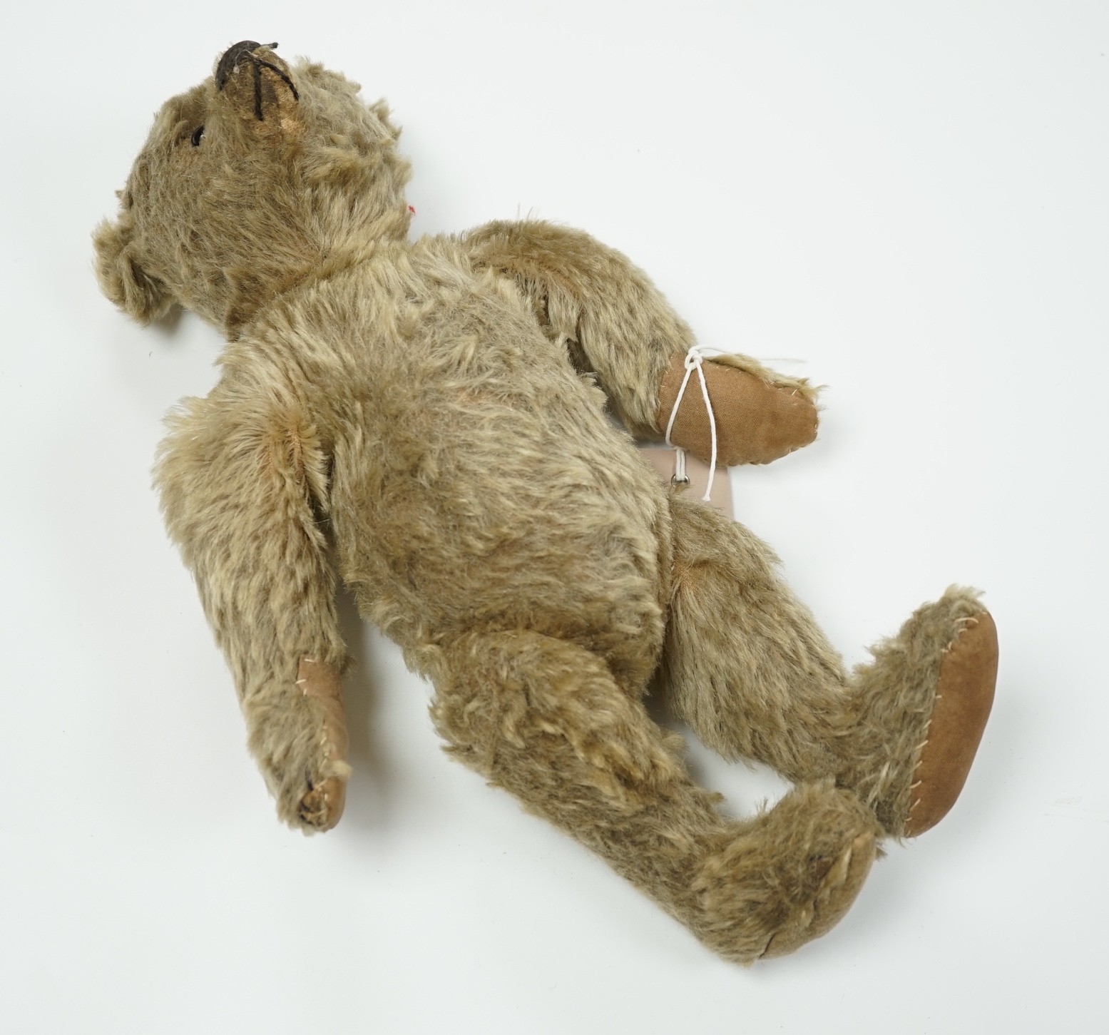 A Steiff teddy bear with button in ear, circa 1910, 35cm